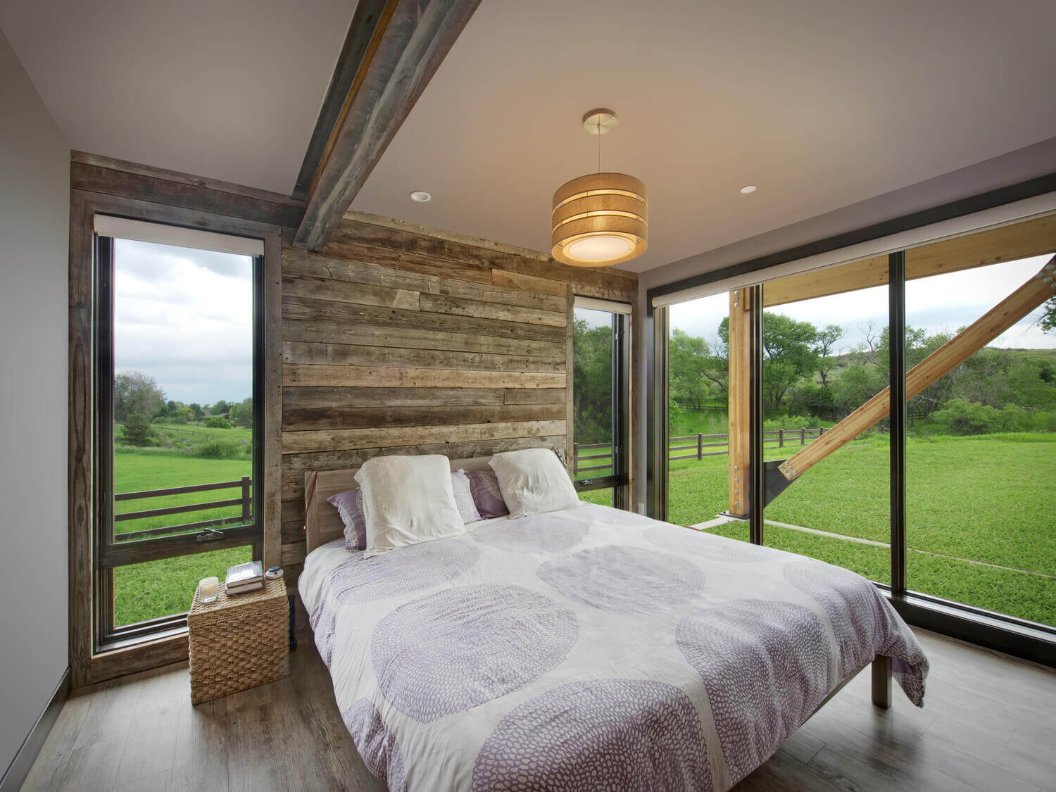 custom home master bedroom with reclaimed wood wall