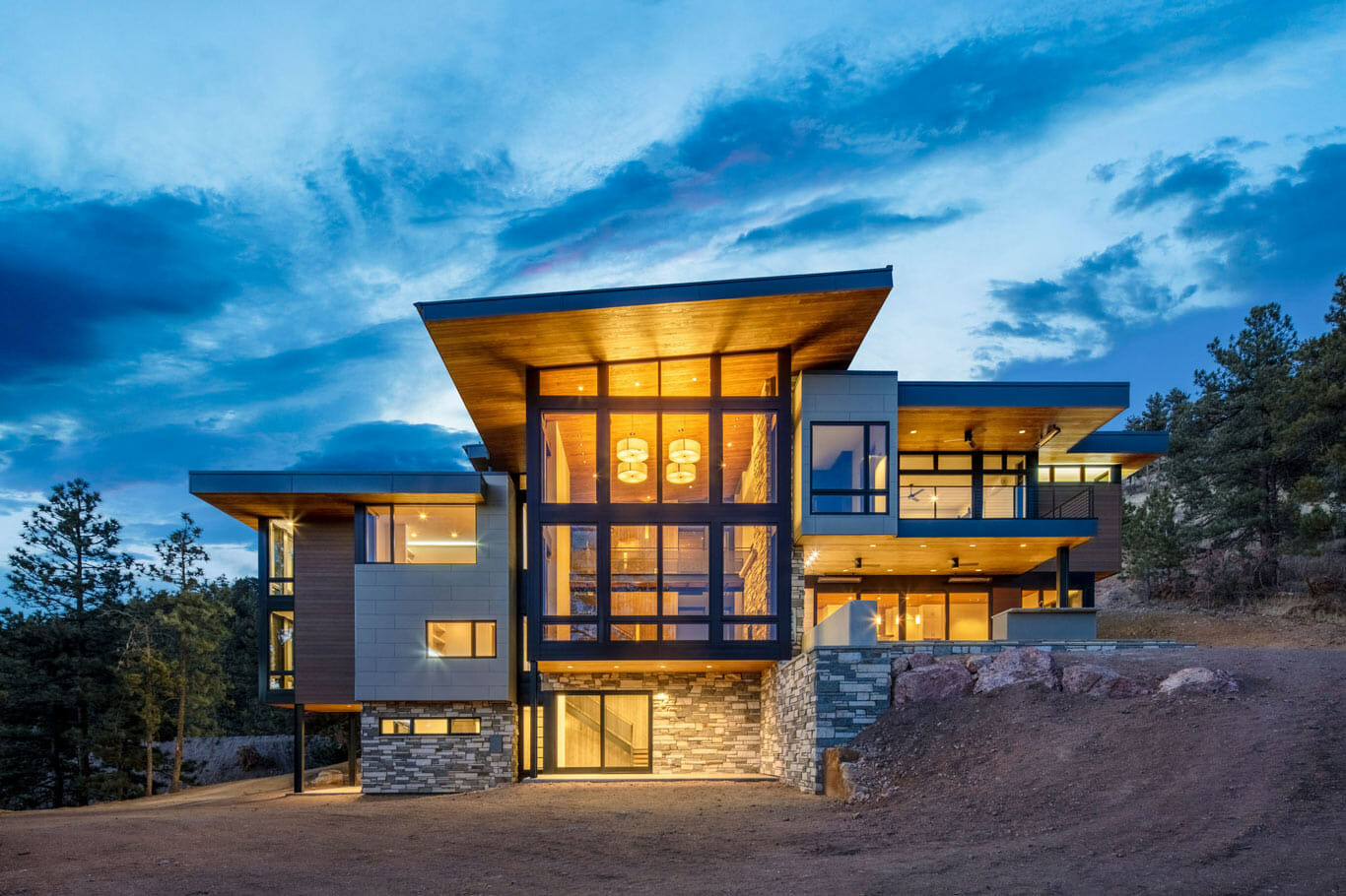 custom home in the mountains with floor to ceiling windows