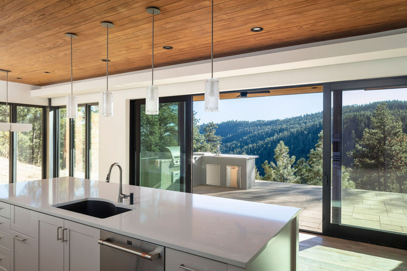 custom home in the mountains with fully opening sliding glass doors