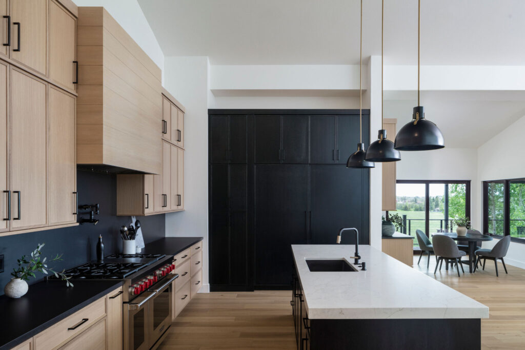 Wildflower custom home - kitchen with island, Wolf appliances, built-in sub-zero refrigerator
