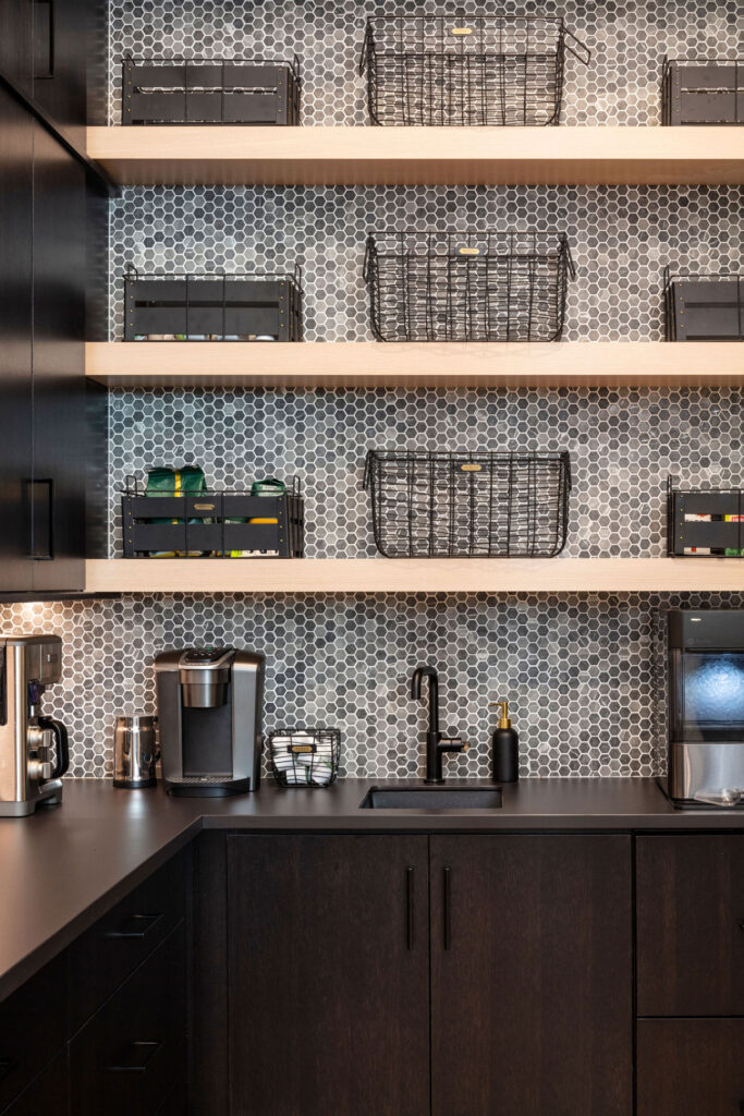 Wildflower custom home - hexagonal tile behind the built-in coffee bar and beverage center