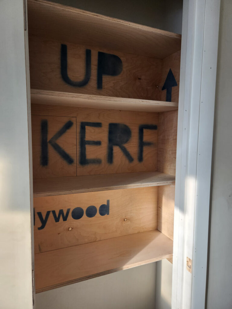 Baltic birch plywood cabinets accented by brightly colored laminate in custom home remodel.