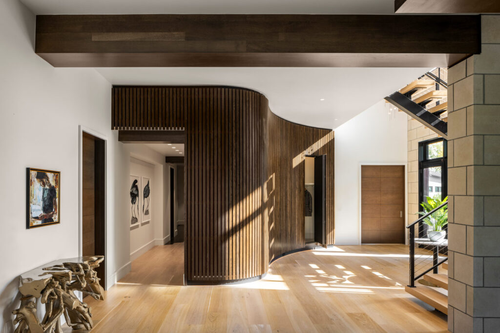 Chateau Brot custom home build interior with featuring curved wall and hallway