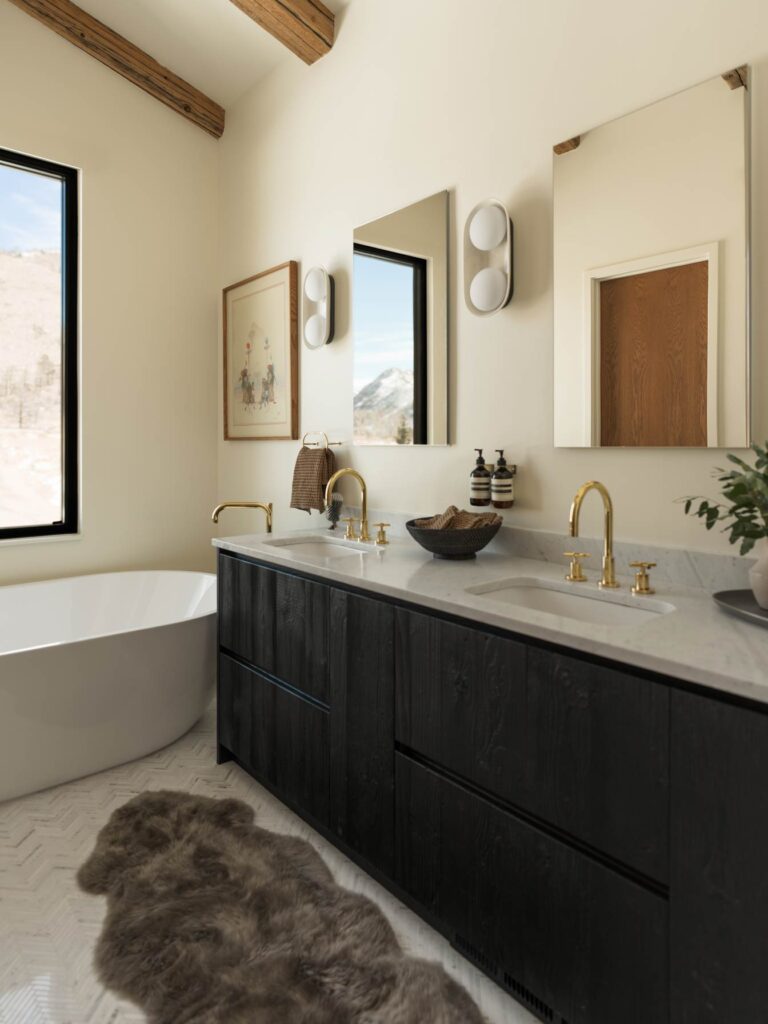 bathroom with gold accents and black cabinets