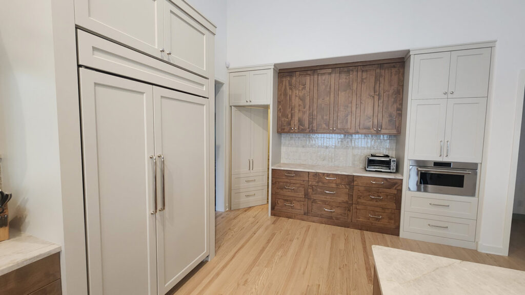 Kitchen showing hidden pantry door open