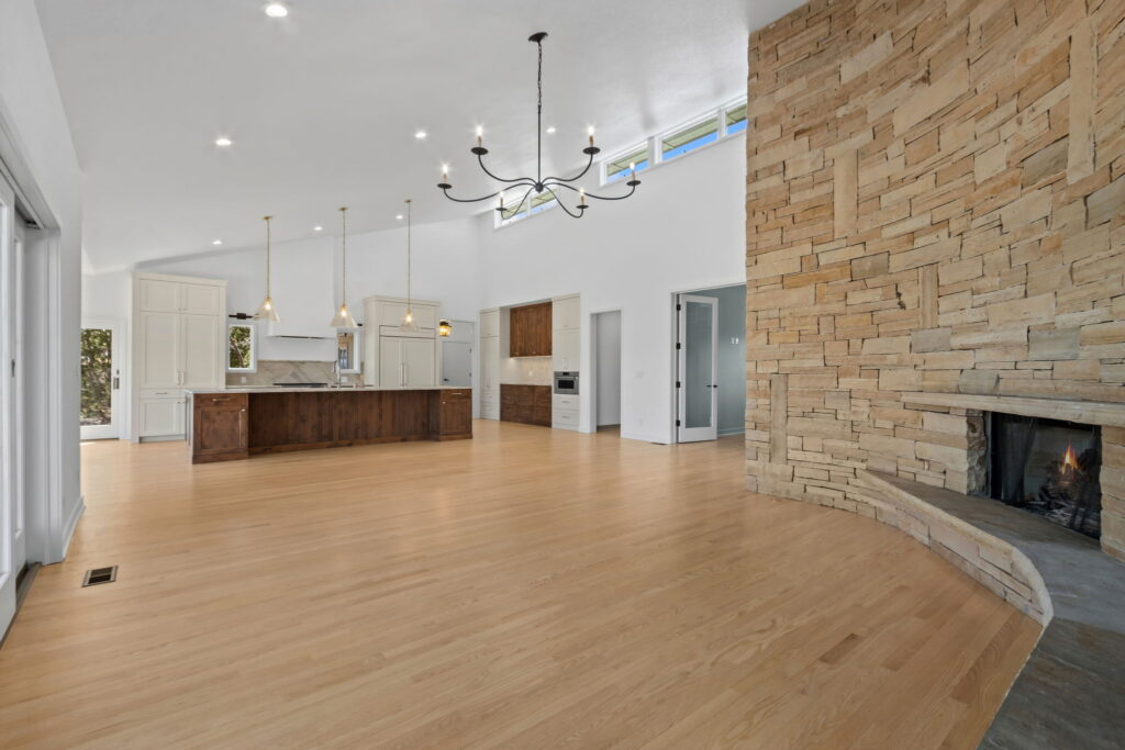 living room with stone fireplace