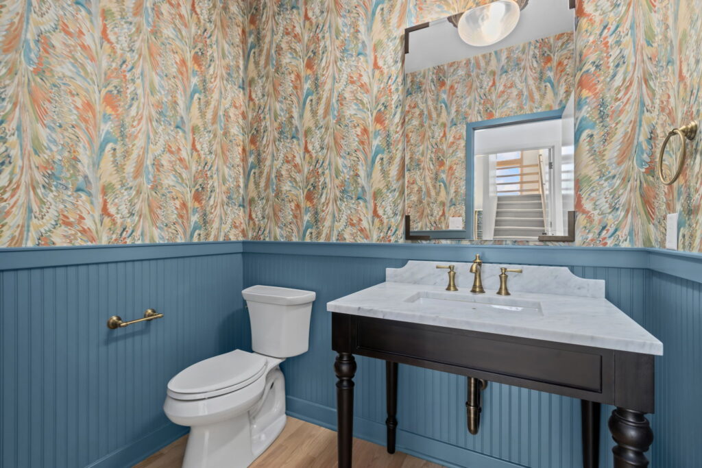 blue bathroom with wall paper